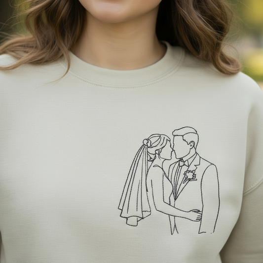 Close-up of wedding couple embroidery on model